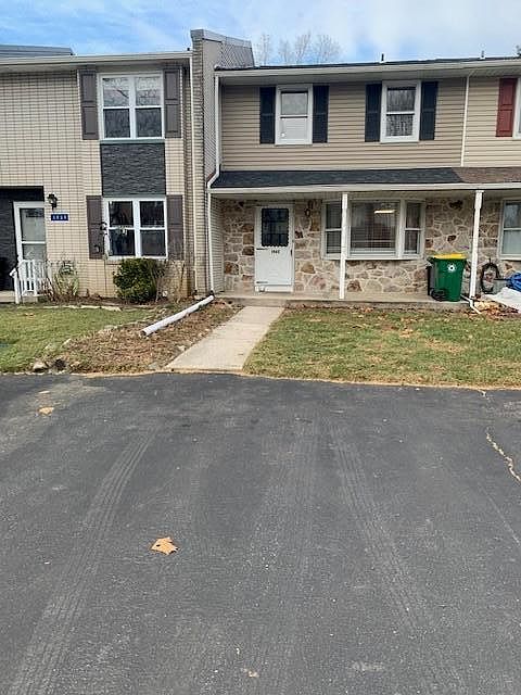 Front of house and parking area