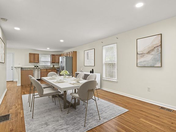 Spacious dining area opens to a stylish, inviting kitchen - perfect for gatherings