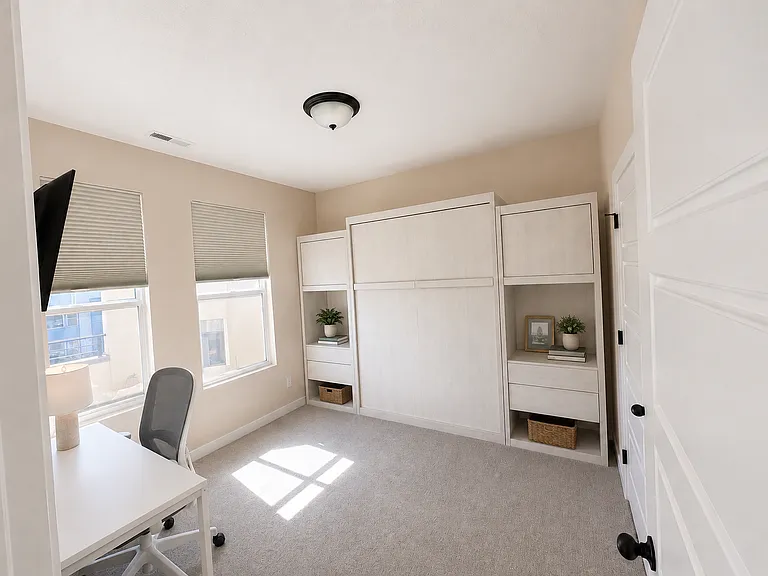 3rd bedroom or office with blackout blinds. Includes a build in Murphy bed for guests (mattress not included)