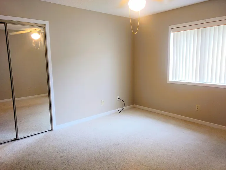 2nd Bedroom with Full Bathroom Adjacent. Window faces private courtyard.