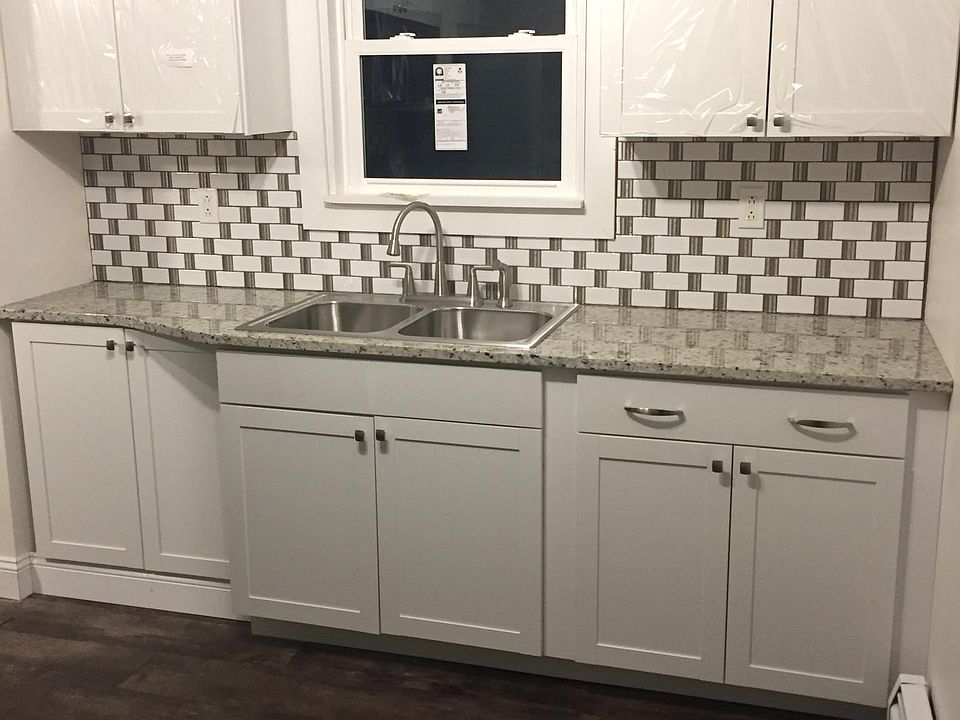 Updated Kitchen with granite counter tops and stainless steel appliances.