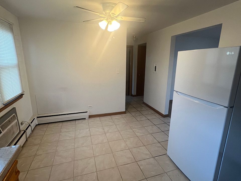 View of kitchen from back door entry