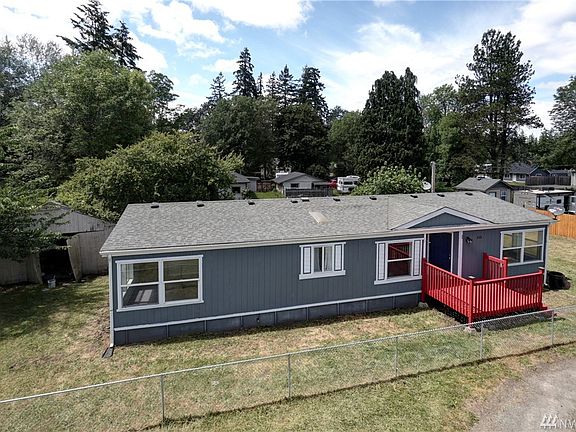 A large front deck adds a pop of color for curb appeal. 