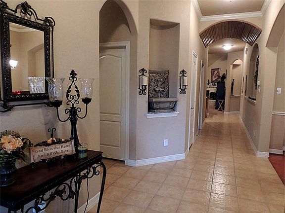 Just inside, the entrance is grand with archways . .