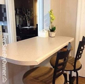 Breakfast Bar
						:
						Spacious kitchen that opens into seating area