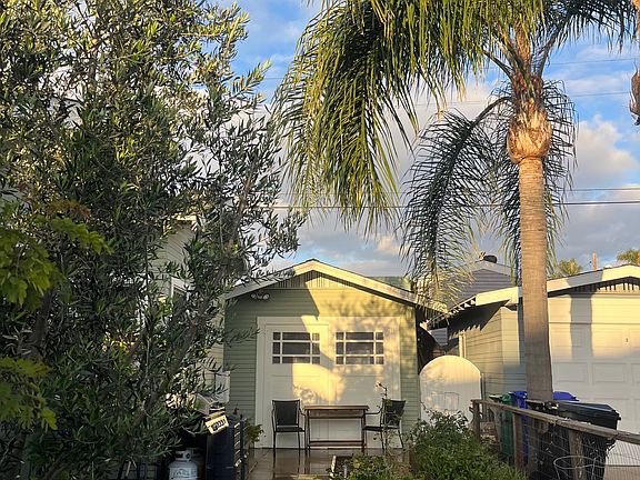 Side yard with raised vegetable beds