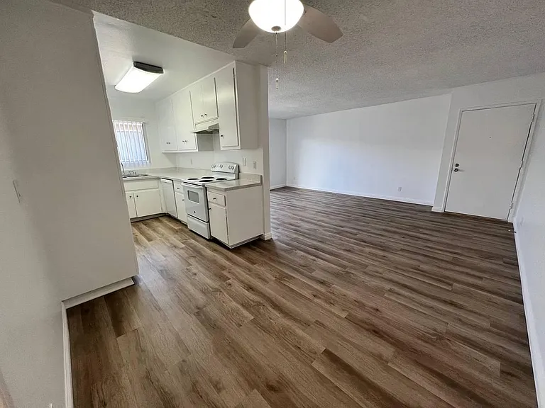Standing in the dining room upstairs 1x1 looking toward entry door and kitchen.