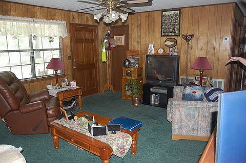 Comfortable Living Room, window overlooks front porch and front yard.