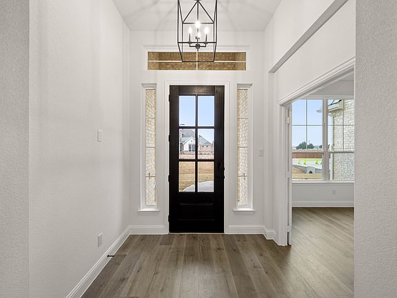 Entryway in a new traditional style home by Kindred Homes