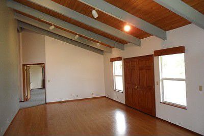 Double front doors open to great room with hardwood floors.
