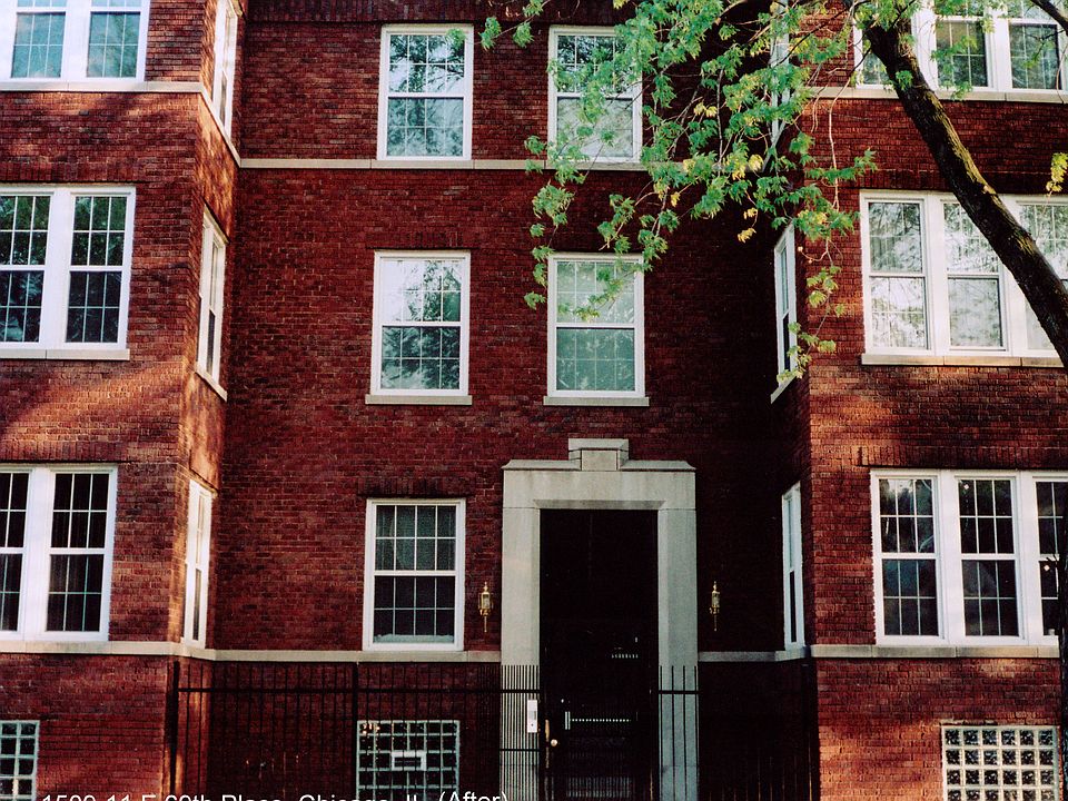 Front of building. Unit 3B front windows visible in upper right.