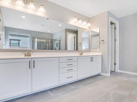Dual vanities in owner s bath