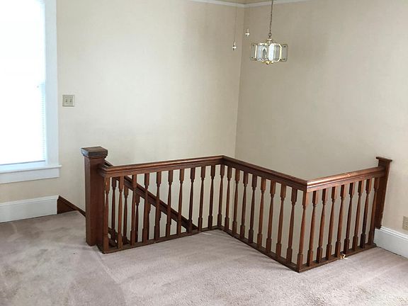 Upstairs landing--large area can serve as a play or study area.