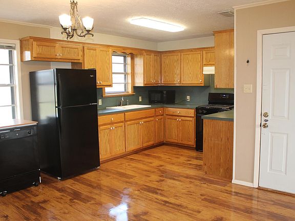 Open kitchen, appliances included! Very well made cabinets.