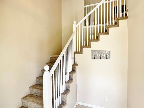 Lobby, stairs and chandelier lights