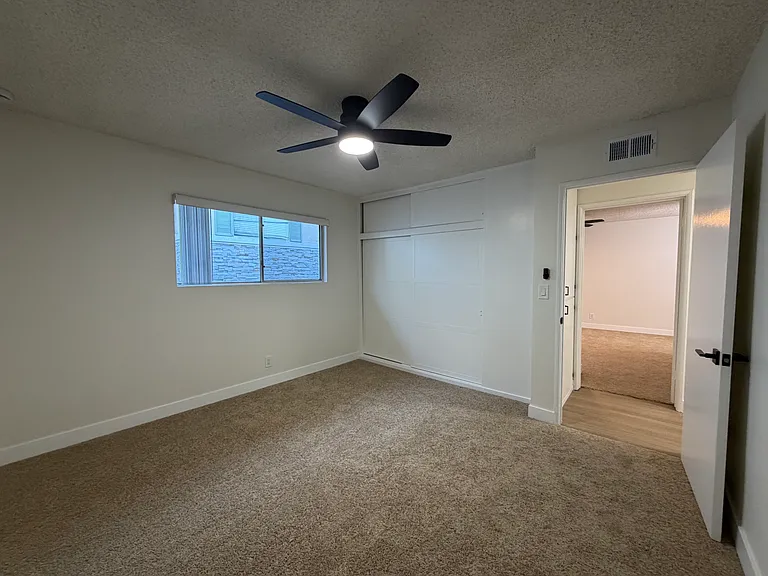 Second Bedroom with Large Closets & Cozy Carpet