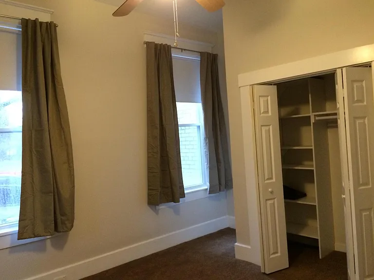 Second bedroom on main floor. Bright with 3 windows.