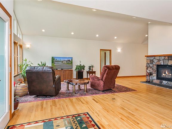 Looking back toward the entry hall showing the beautiful rock wall propane fireplace.