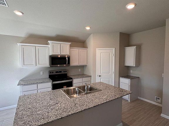 Kitchen - All Home and community information, including pricing, included features, terms, availability and amenities, are subject to change at any time without notice or obligation. All Drawings, pictures, photographs, video, square footages, floor plans, elevations, features, colors and sizes are approximate for illustration purposes only and will vary from the homes as built.