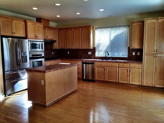 Chef's Kitchen with GE Stainless Steel appliances, gas stove