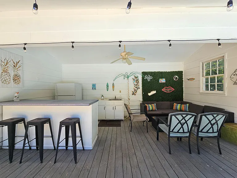 Pool house lounge with outdoor kitchen (sink only usable in summer pool season)