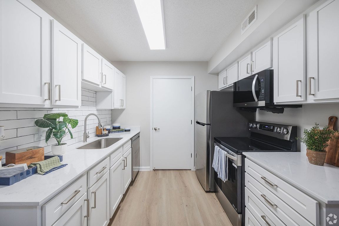 Experience the charm of a modern kitchen designed for culinary excellence.