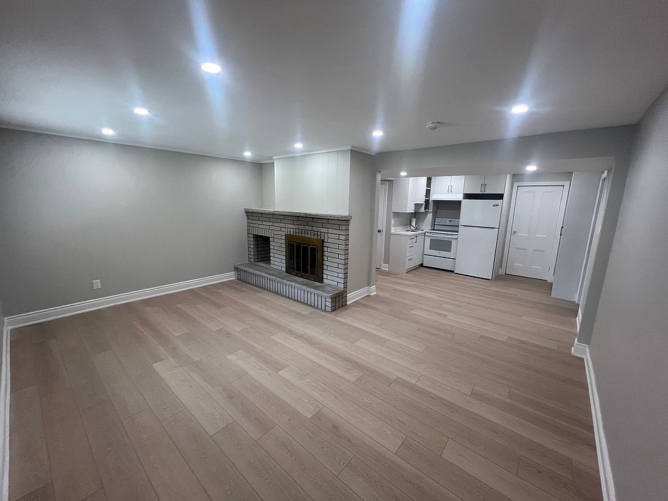 Comfortable family room with large front window and entrance door location.