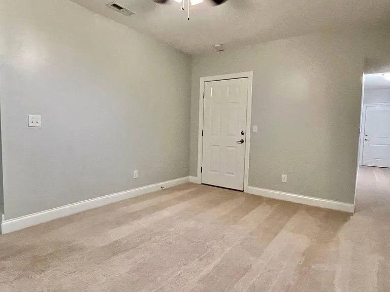 Basement level flex room with separate outdoor access and access to the finished one car garage.