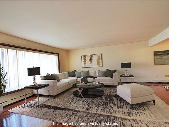 Living room virtually staged to give you an idea how it looks with furniture in it.