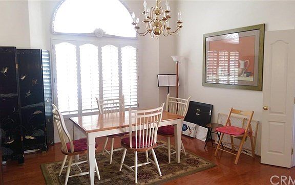 Two story cathedral ceilings plus chandelier are featured in