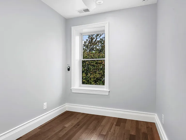 3rd bedroom - street side. single bed works well. length allows different configurations