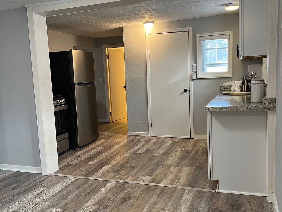 Kitchen farther out view. Note: Includes 2nd back door entry off kitchen with extra storage shelves.