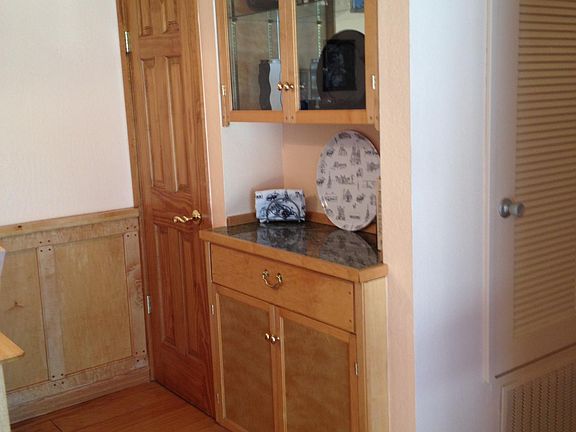 Built-in cabinetry in dining room and large walk-in storage space.