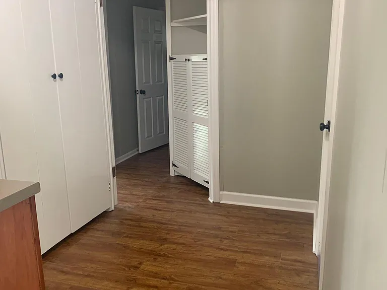 Hall going to master suite includes laundry area