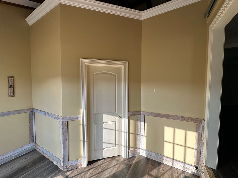 Mud room off the back. Custom barn door and entrance to the rec room with loft.