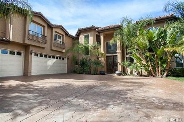 Gated Entry To Front Courtyard w/Stamped Concrete Driveway.