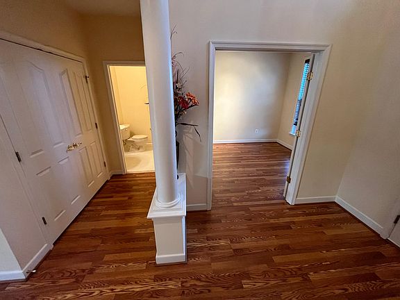 Office entry, front closet, and half bath.