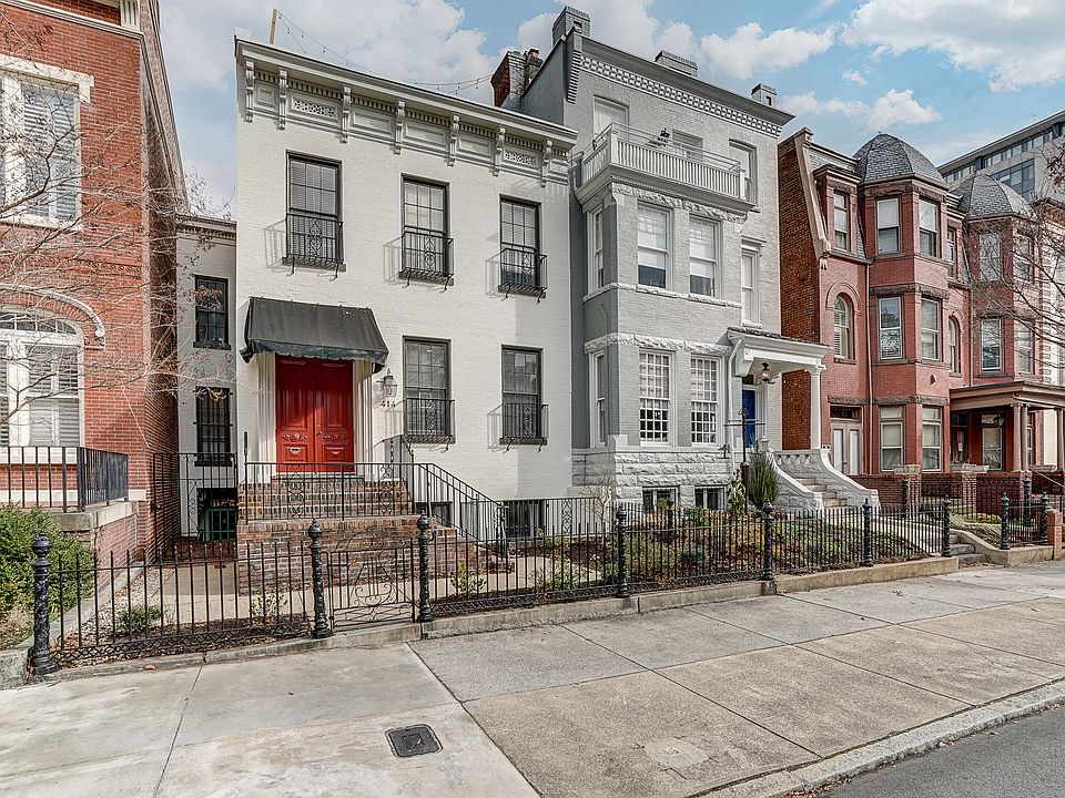 View from front. Apartment is at end of alley to left of the house