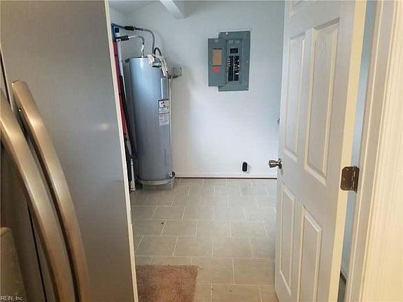 Spacious laundry room/mud room. The house has newer high efficiency washer and brand new energy star dryer in unit.