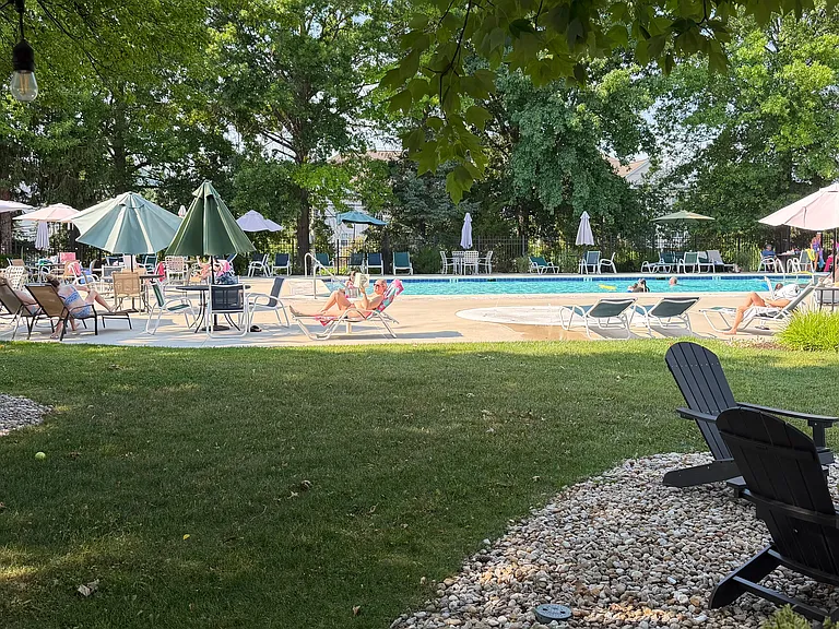 Enjoy the community pool, with lots of umbrellas, loungers, fire pits, accessible bathrooms
