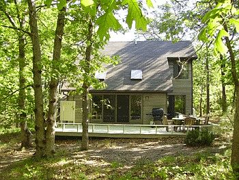 Rear view of deck and house from conservation land