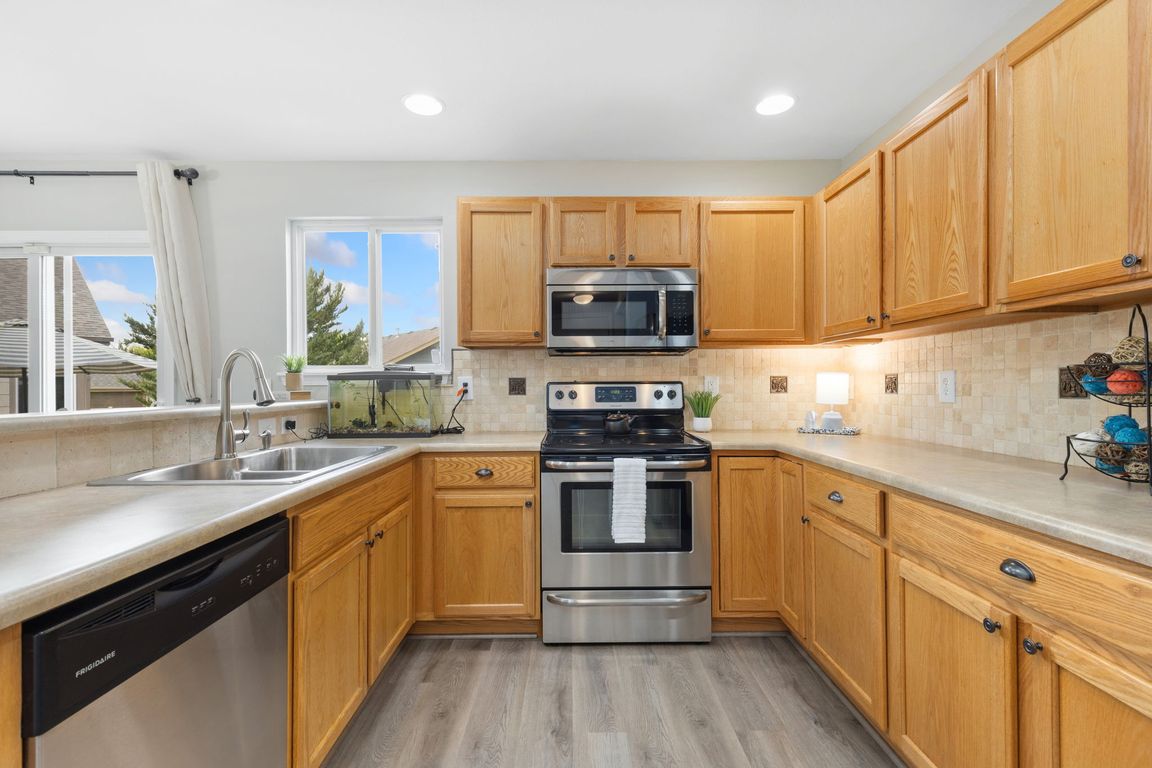 The kitchen includes the stainless steel appliances and offers plenty of cabinets for storage including a walk-in pantry.