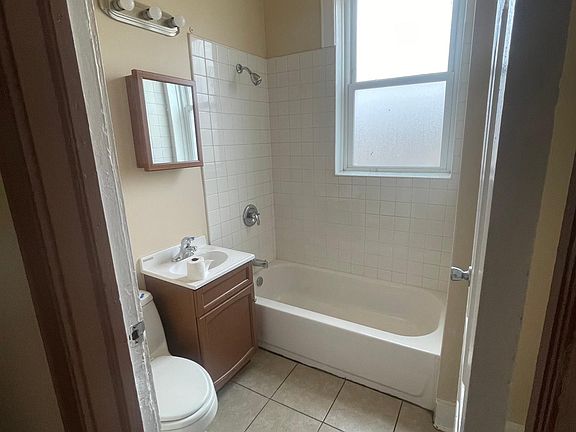 5th image of 5542 S Peoria St #1