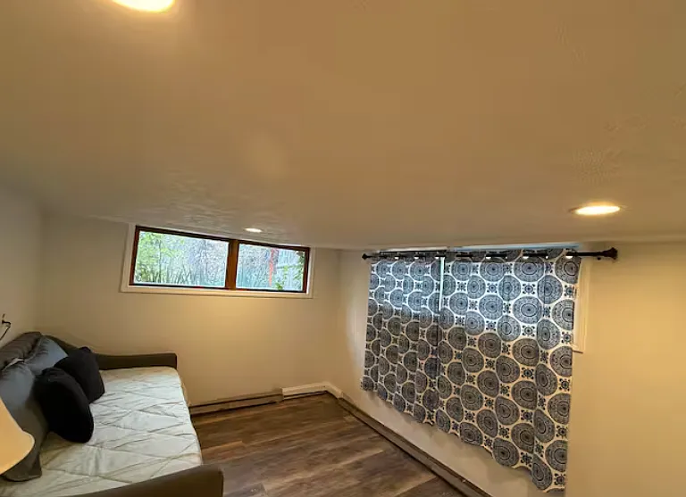 Lower-level bedroom with recessed lighting and generous space _ perfect for guests or a private office.