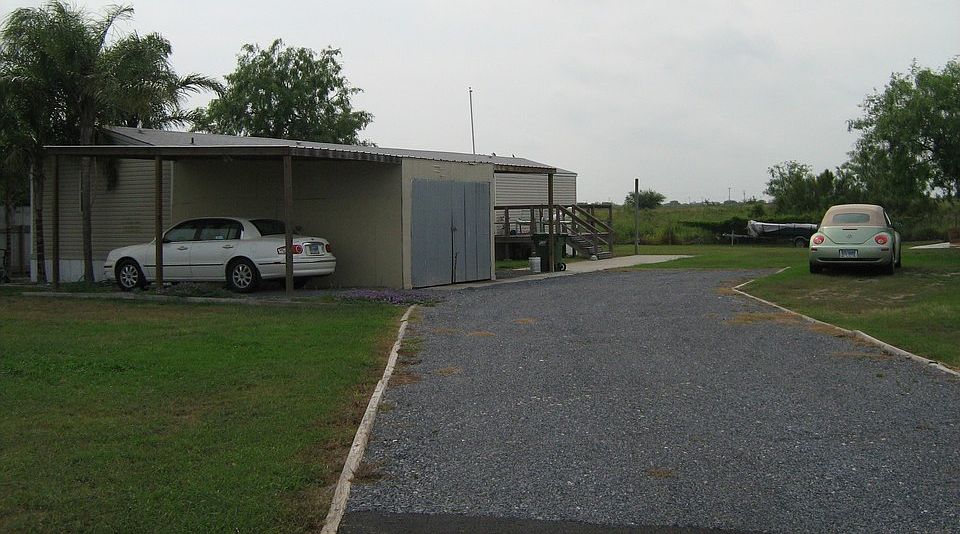 LOTS OF STORAGE, NICE DRIVEWAY AND DECK