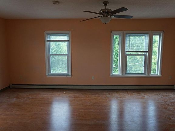 Living room which will be painted a neutral color and cleaned.
