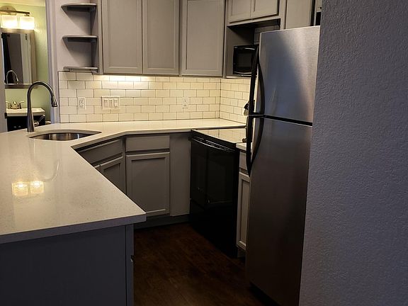 Remodeled kitchen with dish washer and under cabinet lighting.