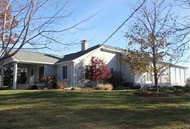 This 4 bedroom home sits on 3.5 acres with stone walls,pond,waterfall.