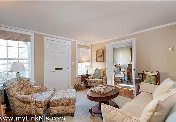 Living room with view into den/office