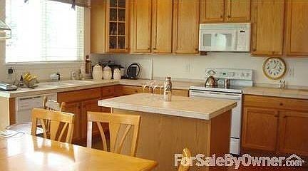 Kitchen, eating area w/ large cabinets